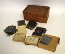 Teak framed box containing a quantity of assorted glass slides