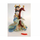 Chinese model of a lady playing a harp, 30cms high