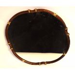 Mahogany framed shaped edge wall mirror with gilded ribbons, 75cms diam