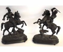 Two models of Conquistadors on horseback on raised bases, 40cms high