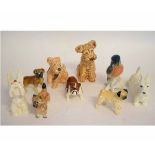 Collection of Beswick dogs modelled in various poses including terriers and bulldogs and also