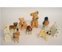 Collection of Beswick dogs modelled in various poses including terriers and bulldogs and also