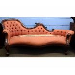 Victorian style mahogany framed chaise longue with coral upholstery and button back with squat