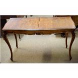 Good quality French oak extending table, supported on four cabriole legs with carved shell knuckles,