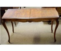 Good quality French oak extending table, supported on four cabriole legs with carved shell knuckles,