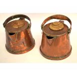 Pair of early 20th century copper jugs with swing handles and wooden lids, stamped "Bulpitt & Sons