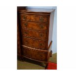 Mid-20th century walnut bow fronted pillar chest of five full width drawers, raised on pad feet with