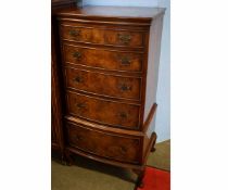 Mid-20th century walnut bow fronted pillar chest of five full width drawers, raised on pad feet with
