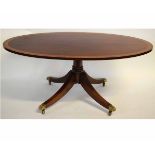 Good quality reproduction mahogany and satinwood inlaid oval coffee table with a turned column and a