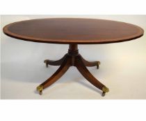 Good quality reproduction mahogany and satinwood inlaid oval coffee table with a turned column and a