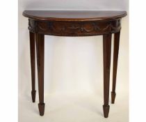 Mahogany demi-lune side table with carved swags and urn detail on tapering square spade feet,