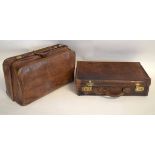 Vintage brown leather gent's travelling suitcase with fitted interior, together with a further large