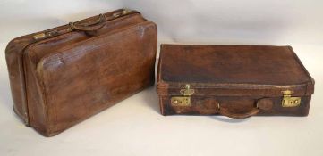 Vintage brown leather gent's travelling suitcase with fitted interior, together with a further large