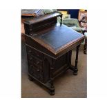 Victorian oak framed Davenport with brass rail galleried back and black leather insert, fitted