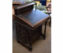 Victorian oak framed Davenport with brass rail galleried back and black leather insert, fitted