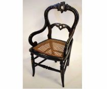 19th century lacquered and mother of pearl inlaid and painted child's chair with scroll arms and