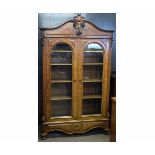 19th century French mahogany double glazed door bookcase with adjustable shelves with carved