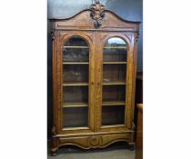 19th century French mahogany double glazed door bookcase with adjustable shelves with carved
