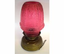 Late 19th/early 20th century lamp with large shaped pink glass shade, 44cms high