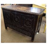 18th century oak coffer with three carved panels to the front, fitted with carved full width