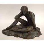 Bronzed model of a young boy in pensive mood