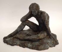 Bronzed model of a young boy in pensive mood