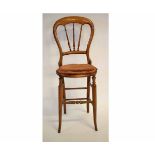 Victorian mahogany child's correctional chair with cane seat and spindle back