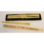 Ivory baton carved with dragons and other pieces of ivory, the baton 30cms