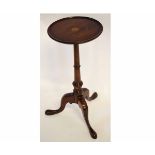 Reproduction mahogany wine table with circular top with satinwood inlay with a turned column and a