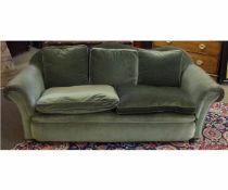 19th century green Dralon upholstered three-seater sofa with shaped back, raised on bun front