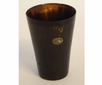 19th century horn beaker of conical form with an inlaid silver panel, 11cms tall