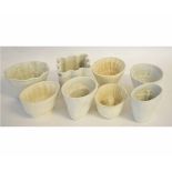 Collection of eight ceramic jelly moulds, the largest 13cms high