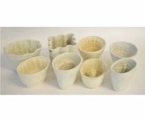 Collection of eight ceramic jelly moulds, the largest 13cms high