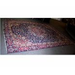 Good quality modern wool carpet with blue field and a central floral lozenge, predominantly