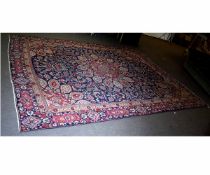 Good quality modern wool carpet with blue field and a central floral lozenge, predominantly