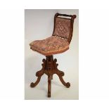 Victorian mahogany musician's chair with puce silk upholstered seat with buttoned detail, with