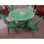 Green painted circular cast aluminium pierced top garden table, together with a set of four cast