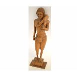 Carved wooden model of a hunter, with a deer over one shoulder, 50cms high