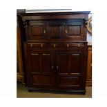 18th century oak tridarn, the top fitted with three panelled cupboard doors, the base with three