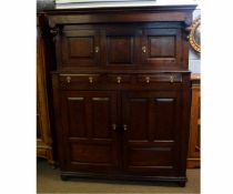18th century oak tridarn, the top fitted with three panelled cupboard doors, the base with three