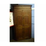 Oak full height corner cupboard, fitted with four panelled doors, 47cms wide x 214cms high