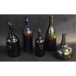 Group of five antique bottles with various impressed letters including ASCR and one bottle impressed