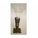 Glass vase encased in ornate brass holder, 28cms high