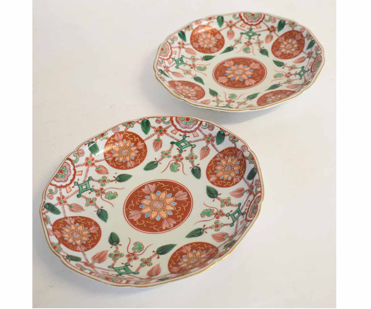 Pair of 19th century Japanese plates with circular floral lozenges and a gilded design with a four