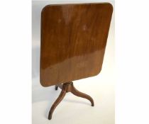 Georgian mahogany rectangular tilt top table with a turned column tapering to a tripod reeded