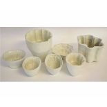 Collection of ceramic jelly moulds, comprising 6 moulds and a larger mould, the largest 18cms high
