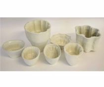 Collection of ceramic jelly moulds, comprising 6 moulds and a larger mould, the largest 18cms high