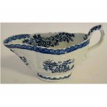 18th century English porcelain sauceboat possibly Isleworth, the exterior with blue printed na ve