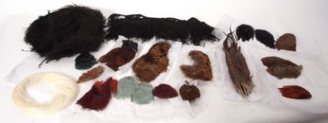 Box of assorted feathers etc