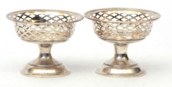 Two George V bon-bon baskets, each of circular form with pierced galleries and raised on pedestal